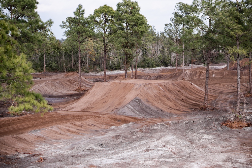 Freshly groomed motocross track winding through the pines at Salty Acres